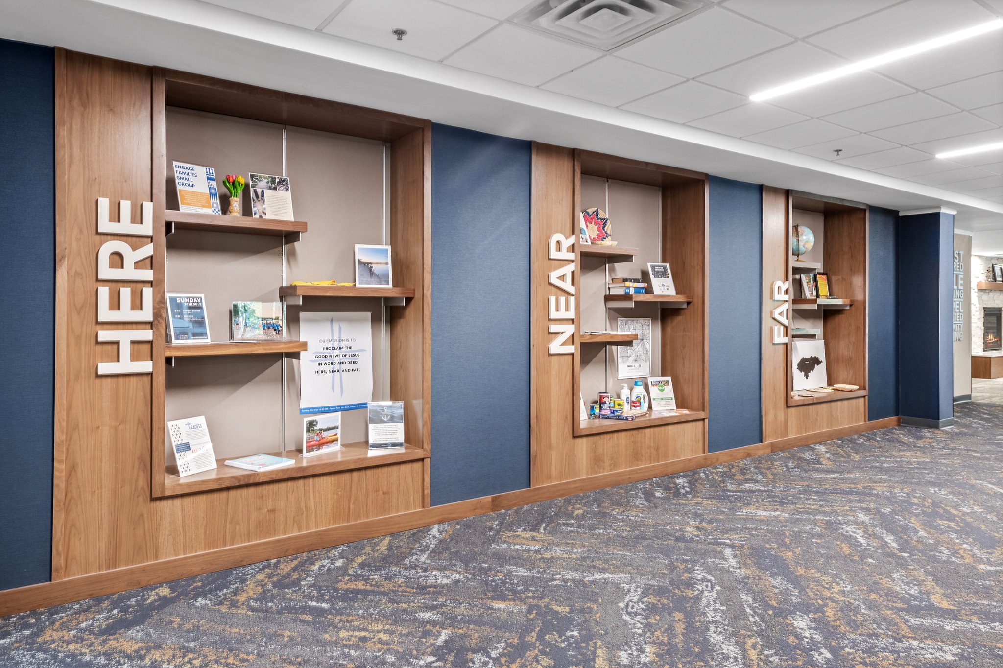 Custom wooden shelving units in a modern commercial space for displaying items and maximizing storage.