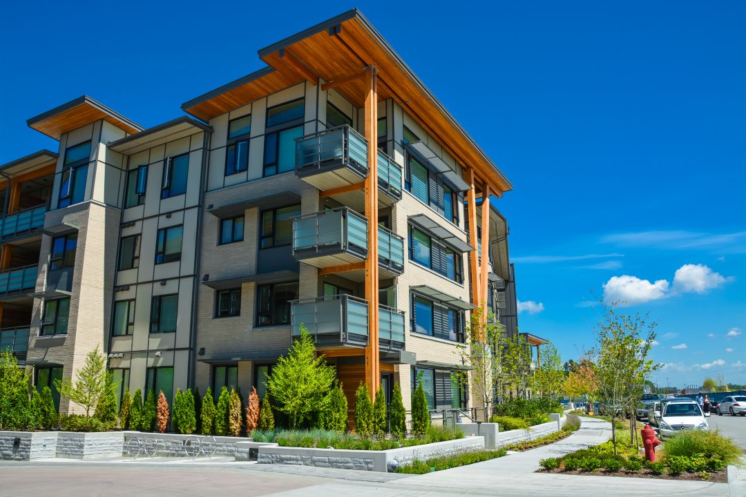 Exterior of modern apartment buildings, showcasing the type of projects where VHC Wood Products provides custom cabinetry and architectural woodwork.