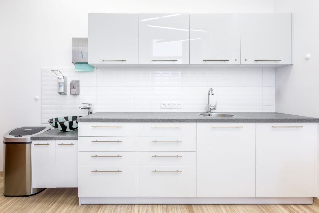 Custom white cabinets in a medical facility, representing VHC Wood Products' commercial cabinetry solutions for various sectors including apartments, hotels, senior living facilities, schools, and more.