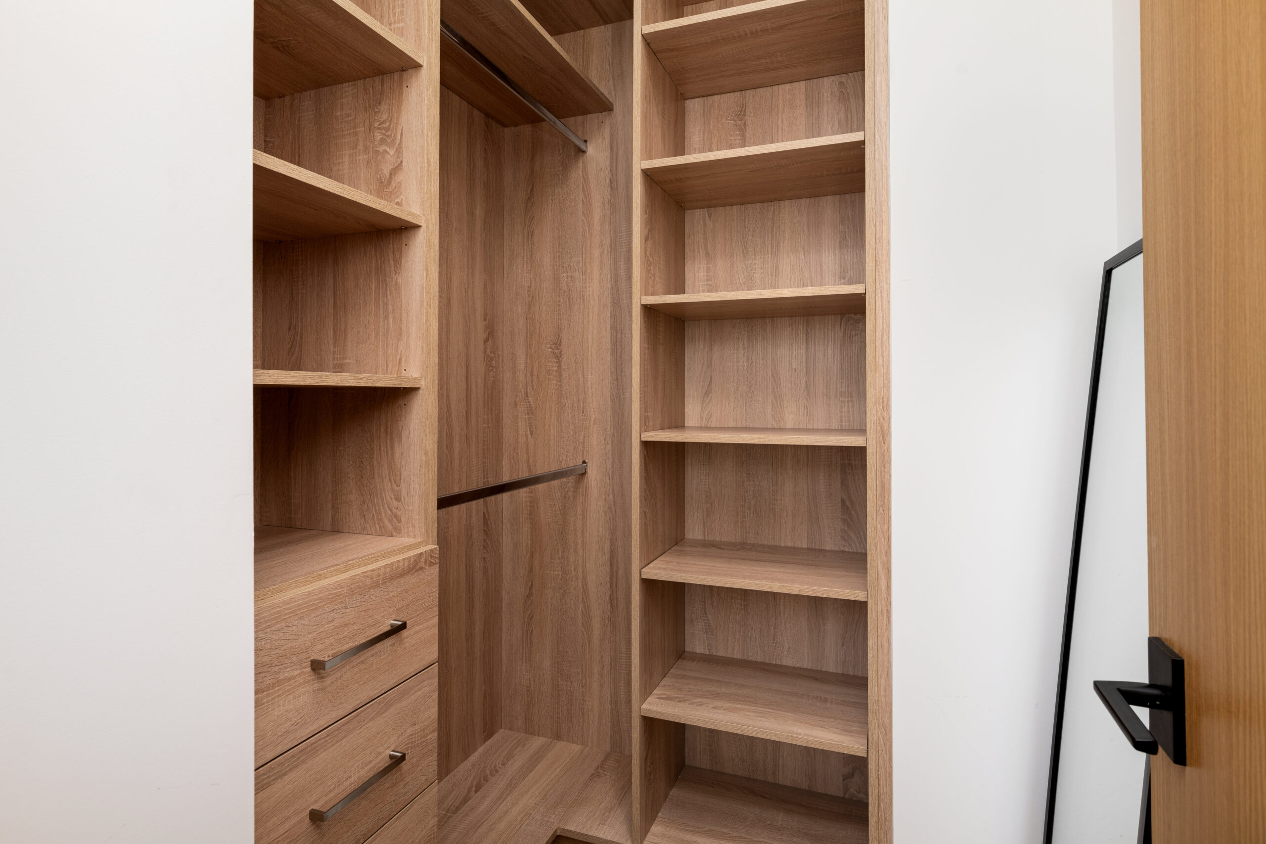 Custom closet shelving and cabinetry manufactured and installed by VHC Wood Products.