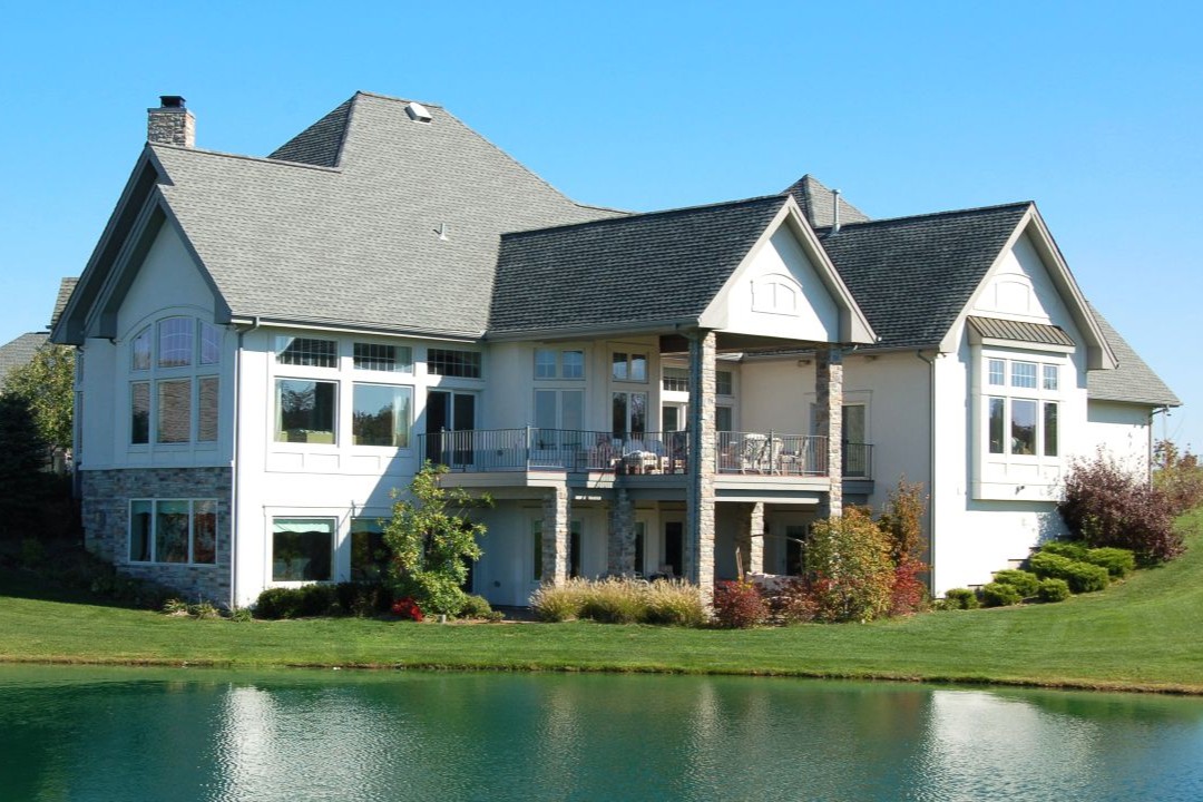 Exterior of a high-end residential property, showcasing the type of projects where VHC Wood Products provides custom cabinetry and woodwork.